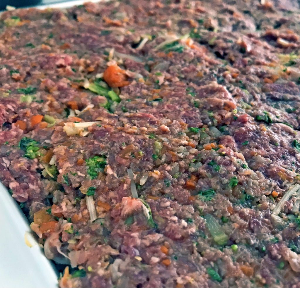 Hidden veggie meatloaf mixture prepared in a baking pan